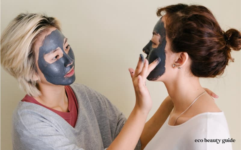 frienda applying charcoal masks to face